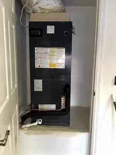 New air handler installed in a utility closet.