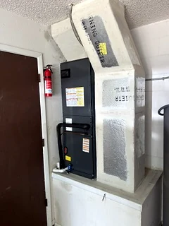 Newly installed air handler with a wrapped supply plenum.