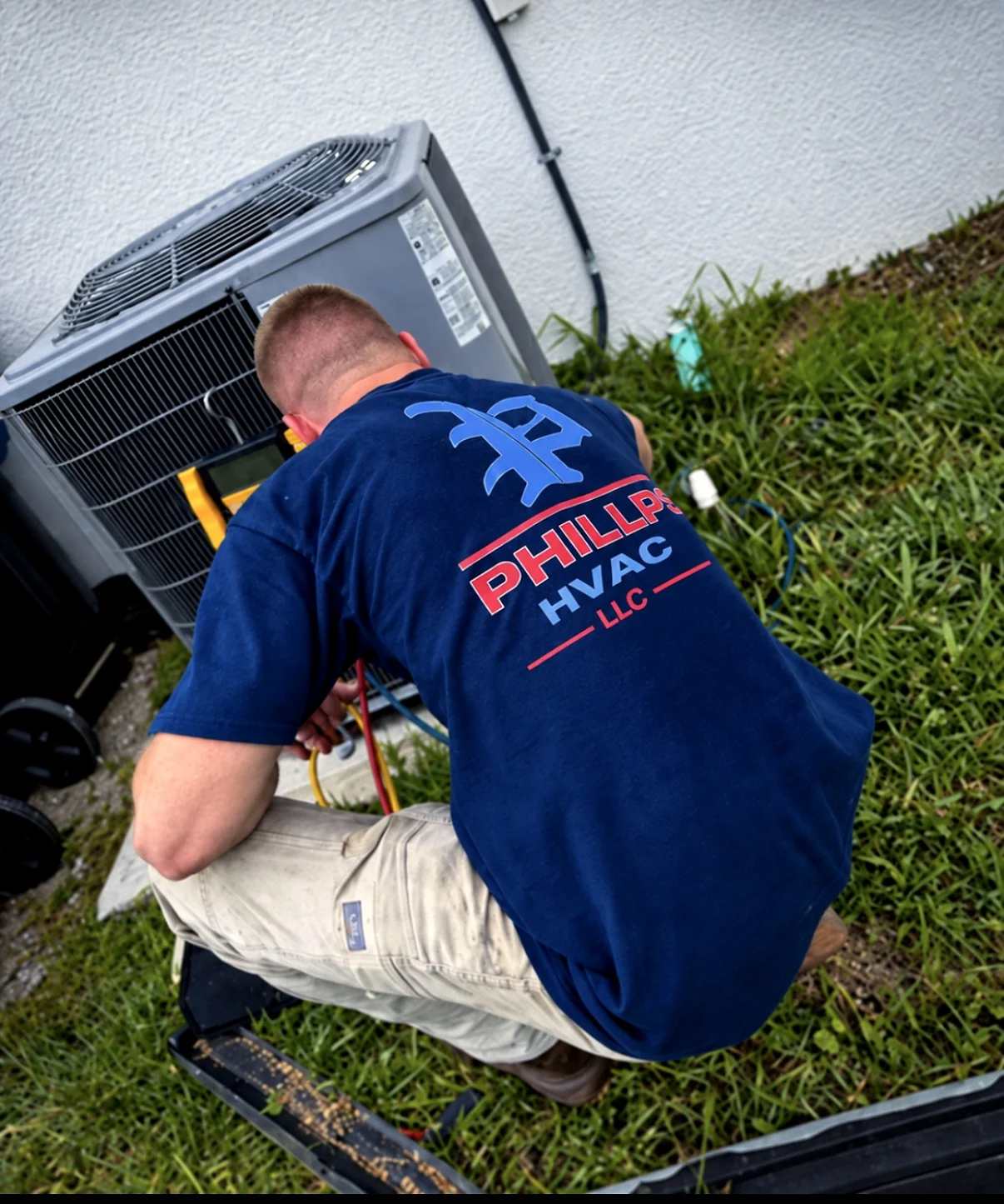 Aron Phillips of Phillips HVAC troubleshooting an outdoor condenser on a no-cool service call.