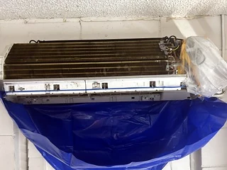 Mini-split indoor unit opened for a maintenance cleaning.