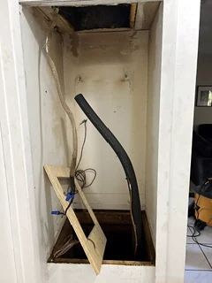 Air handler closet with the platform and copper line set being replaced.