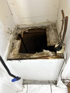 Rotted air-handler platform found during inspection, before replacement.